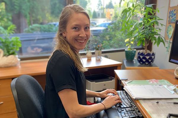 Sarah Hamm, ARNP, MSN working at her computer